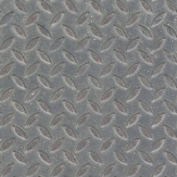 Seamless texture of sheet of grey metal with embedded leaf-like shapes in surface.